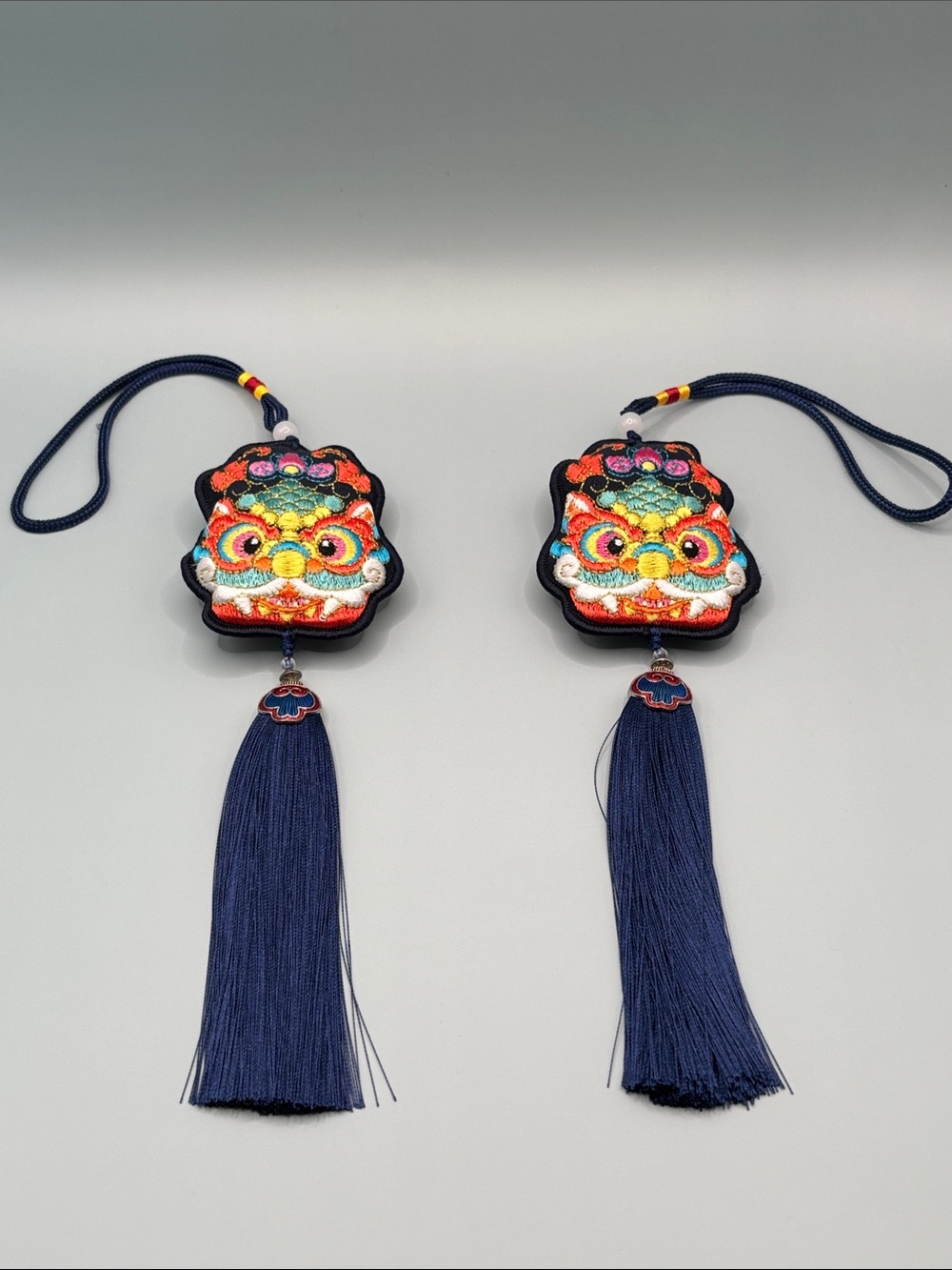 Cheerful Embroidered Asian Lion Face Tassel Charms Set of 2 - Navy Multicolor